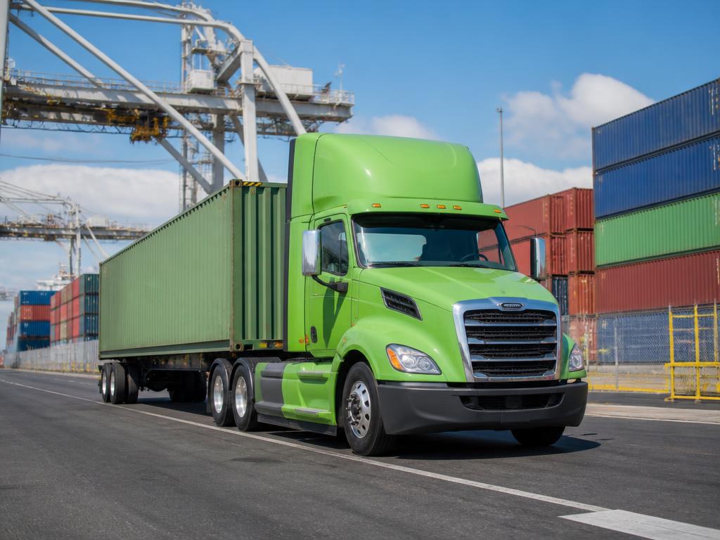 DPN Logistics lime green semi truck hauling a container at the Port of Virginia